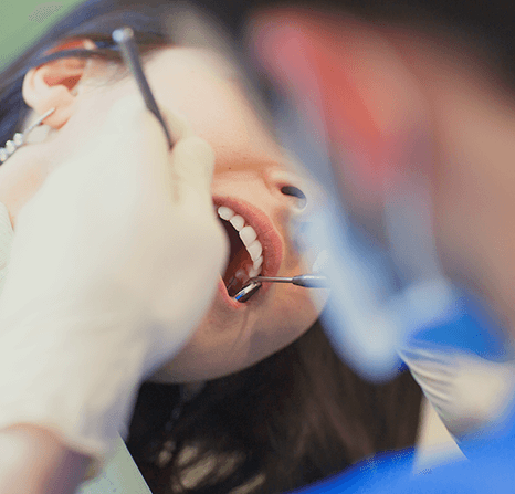 Dentist checking patient's gums